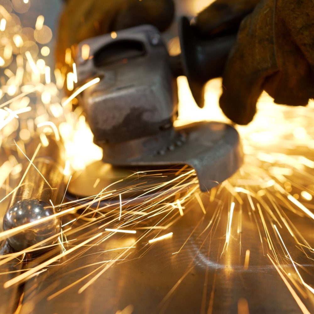Grinding,A,Metal,Door,In,Production.,Grinding,A,Steel,Structure